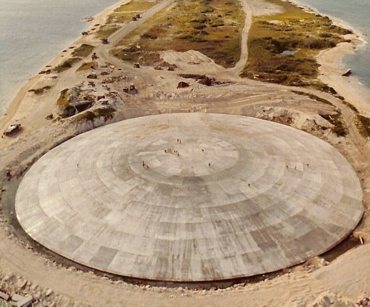 Runit Dome (or Cactus Dome), Runit Island, Enewetak Atoll. Aerial view. In 1977-1980 the crater created by the Cactus shot of Operation Hardtack I was used as a burial pit to inter 84,000 cubic meters of radioactive soil scraped from the various contaminated Enewetak Atoll islands. The Runit Dome was built to cover the material.