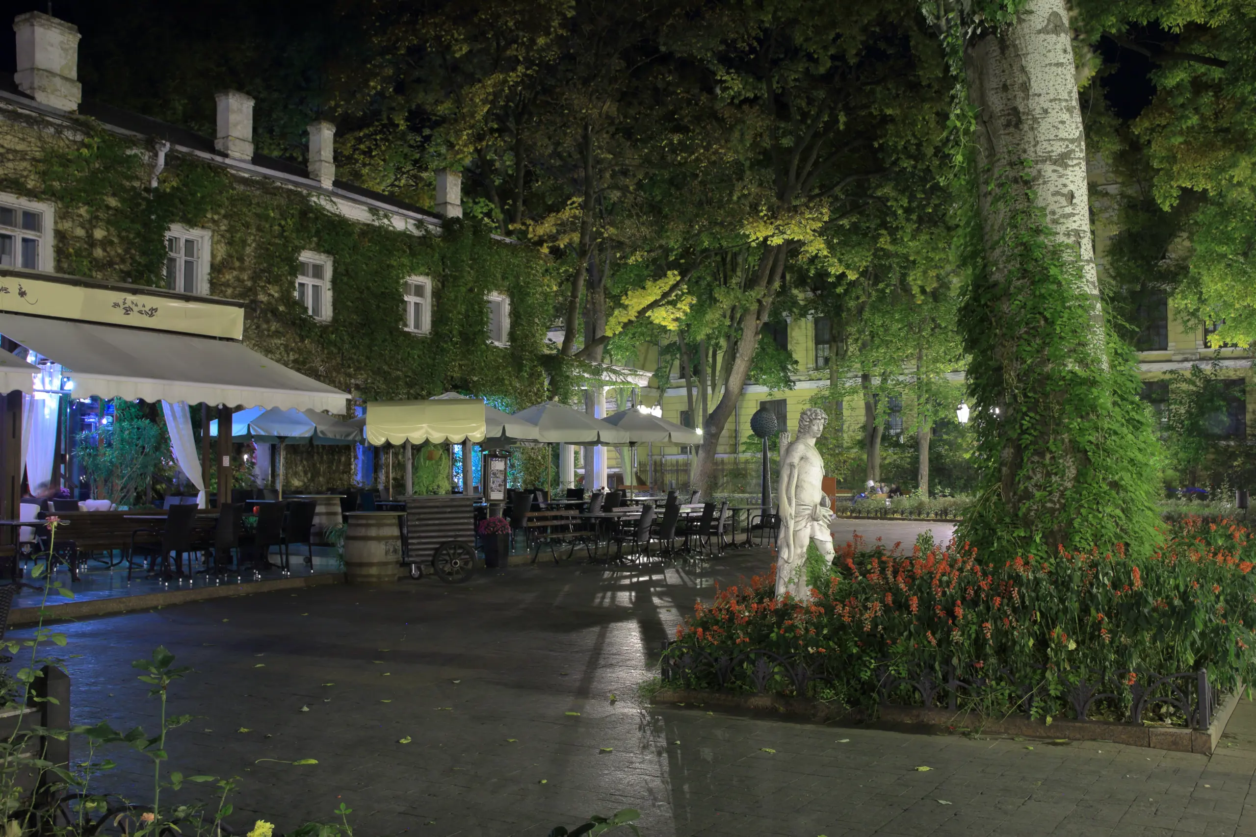 VistaCreate 618927970 stock photo photo shows street cafe night city garden odessa scaled