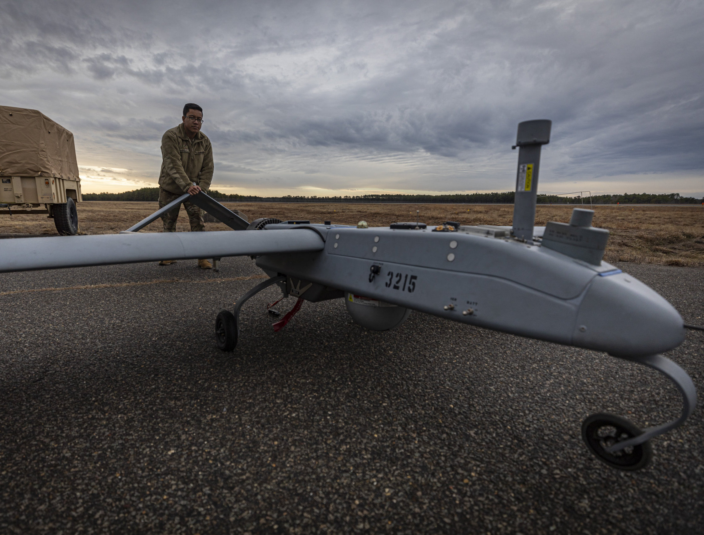 U.S. Army Pfc. Antonio Arriola, a Soldier with the New Jersey National Guard’s Det. 1, D Co., 104th Brigade Engineer Battalion “Skydevils” pushes an RQ-7B Shadow unmanned arial system on Joint Base McGuire-Dix-Lakehurst, N.J., Feb. 10, 2020. U.S. Air National Guard photo by Master Sgt. Matt Hecht